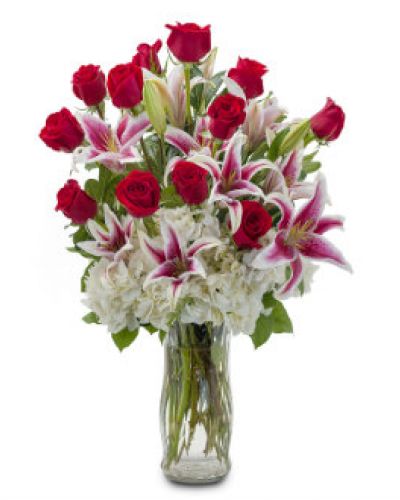 <p>Deliver inspiration to your special someone with this classically gorgeous arrangement of a dozen red roses accented with lilies and hydrangea.</p>