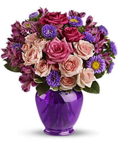 Elegance without extravagance, this magnificent bouquet features a gorgeous blend of pink roses and lavender favorites in a classic ginger jar of translucent purple. The effect is stunning!
The elegant bouquet includes hot pink roses, light pink spray roses, lavender alstroemeria, lavender matsumoto asters and lavender cushion spray chrysanthemums accented with fresh greenery.