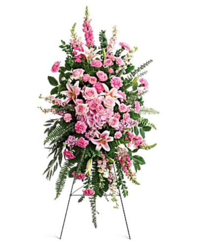 <div class="m-pdp-tabs-description">
<div id="mark-1" class="m-pdp-tabs-marketing-description">This glorious spray of pink hydrangea, roses and lilies is an especially fond, feminine farewell to one deeply loved.</div>
</div>
<p id="arrngDescp">This glorious spray includes pink hydrangea, light pink roses, light pink spray roses, pink oriental lilies, pink carnations, miniature light pink carnations, pink larkspur, pink snapdragons, pink stock, huckleberry, sword fern, asparagus plumosus and greenery. Delivered on a wire easel.</p>