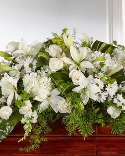 <p>Share serenity and peace with those who have recently lost a loved one with our Abundance Casket Spray. Composed of roses, snapdragons, lilies and hydrangea, this luminous collection of white and ivory hues comes together to create an elegant tribute.</p>