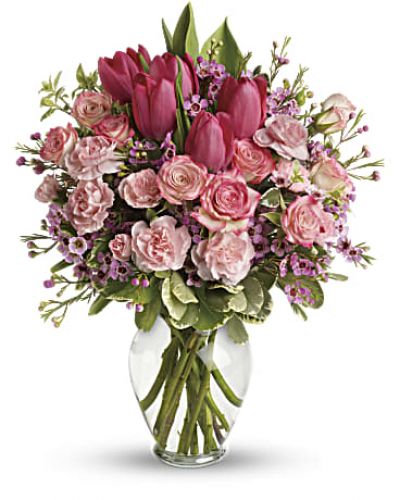 <p>It's beauty-full! Bursting with tantalizing tulips and radiant roses, this delightful pink arrangement brings spring joy to that special someone.<br />
Includes pink roses, tulips, carnations and waxflower, accented with fresh pitta negra and variegated pittosporum.<br />
Delivered in a lovely glass vase.</p>