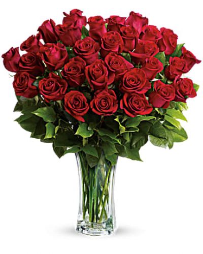 <p>Shout your love from the rooftops with long stemmed red roses artistically arranged in a cut crystal vase. These red roses make a spectacular romantic bouquet. She'll be yours forever.<br />
Standard- 24 Elegant Roses<br />
Deluxe-30 Beautiful Blooms<br />
Premium-36 Exquisite Roses</p>