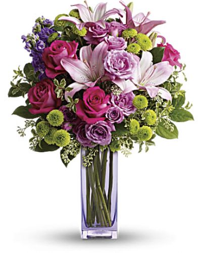<p>No one can resist the beauty of this bright bouquet! A sublime way to celebrate any occasion, this special delivery blends hot pink and lavender roses with pink lilies and lime green button mums for a look that's pure heaven. It's all artfully arranged in our exclusive, lovely lavender glass vase they'll always treasure.</p>